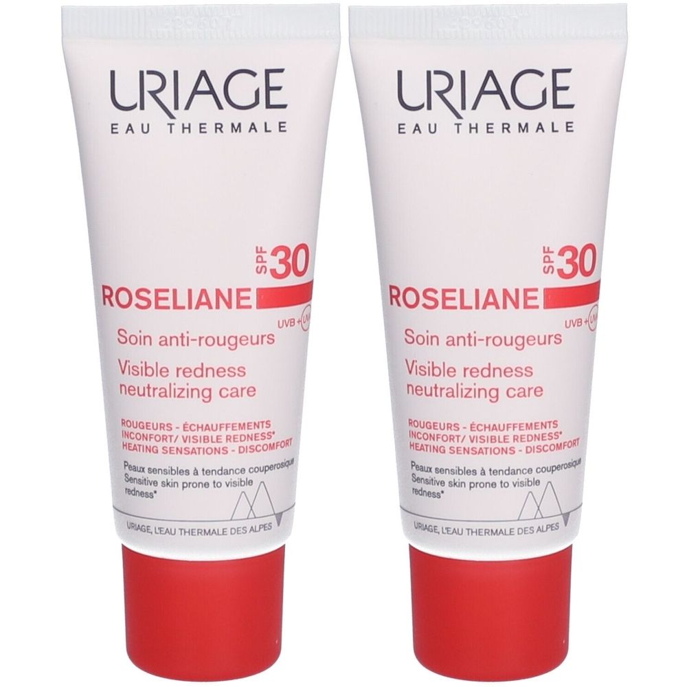 Deux tubes de crème Uriage Roséliane, blanc avec bouchon rouge. Texte: Roséliane, SPF30.