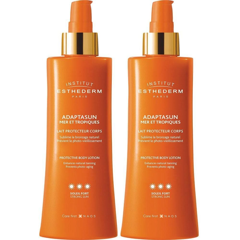 Twee oranje flessen met gouden pompkopjes. Opschrift: Institut Esthederm, Adaptasun Mer et Tropiques, Lait Protecteur Corps.