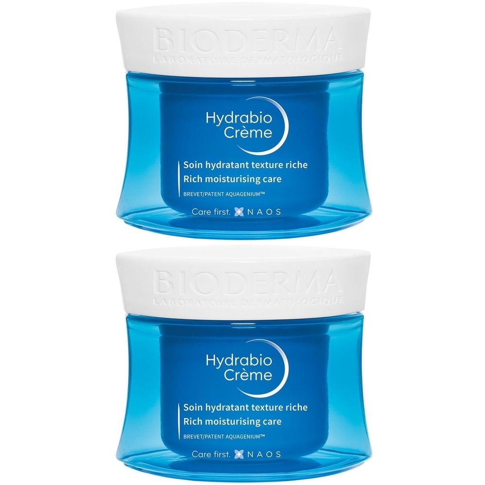 Twee blauwe potten met witte deksels. Opschrift: Hydrabio Crème. Tekst: Soin hydratant texture riche. Merk: Bioderma.