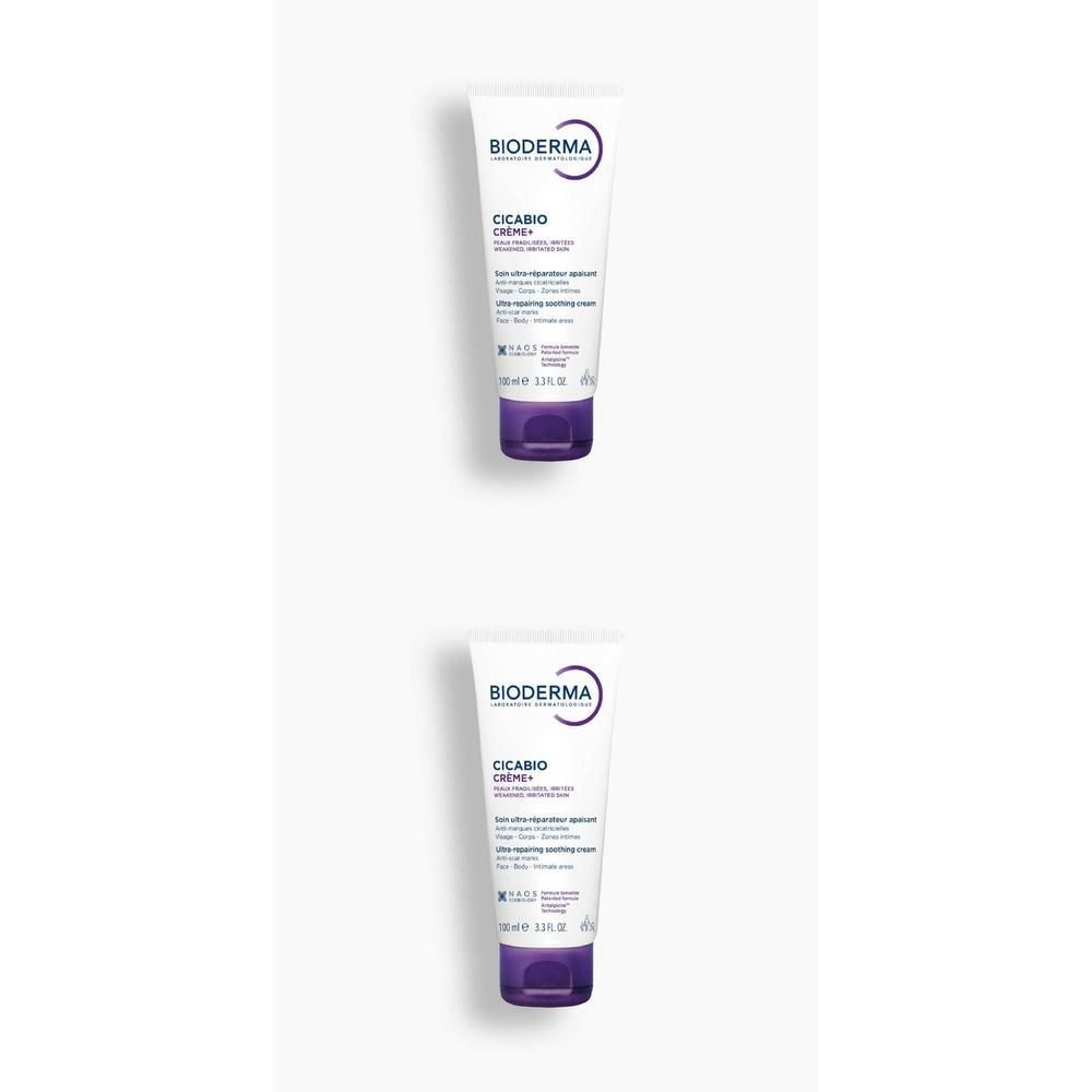 Twee tubes crème. Opschrift: BIODERMA, Cicabio Crème+, Ultra-herstellende, verzachtende crème. Witte tube, paarse dop.