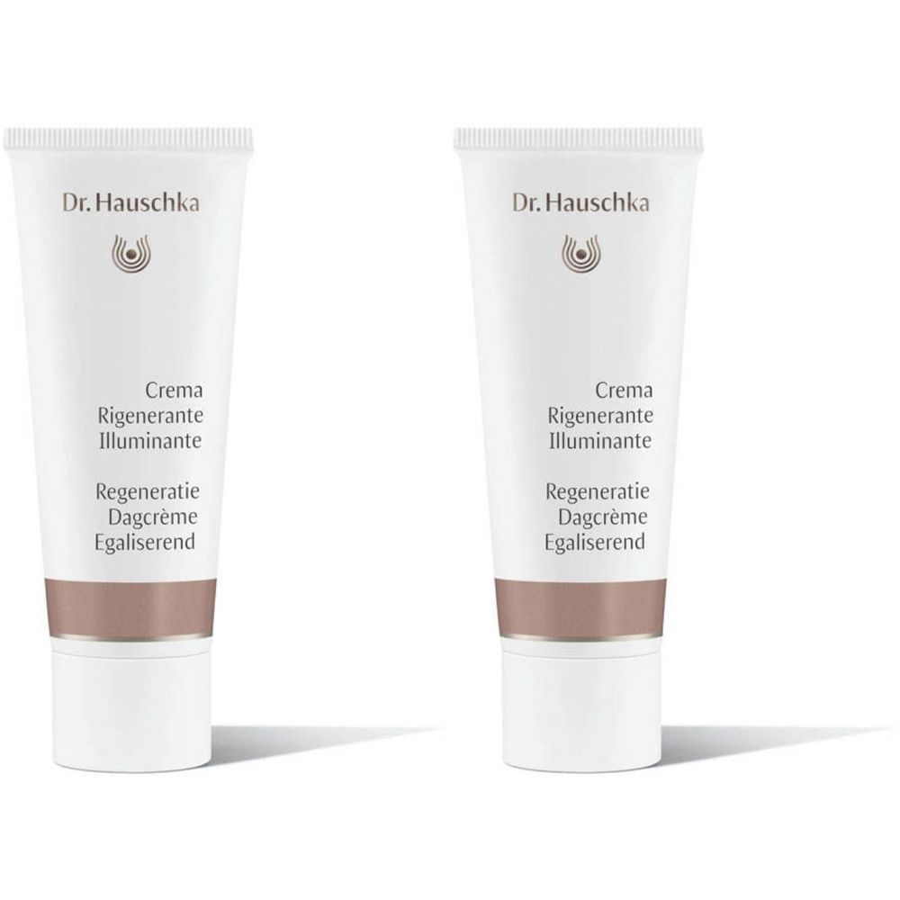 Twee crèmetubes. Opschrift: Dr. Hauschka, Crema Rigenerante Illuminante, Regeneratie Dagcrème Egaliserend.