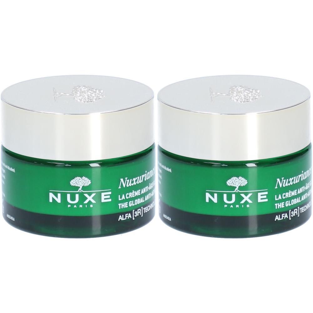 Twee groene crèmepotten met zilveren deksels. Opschrift: NUXE Paris, Nuxuriance Ultra, La Crème Anti-Âge Global.