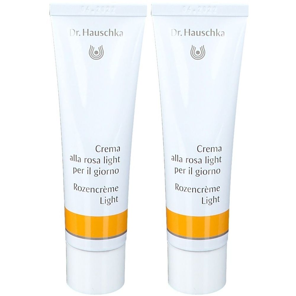 Twee crèmetubes. Wit, met gele streep en tekst. Merk: Dr. Hauschka. Tekst: Crème de Jour Légère à la Rose.