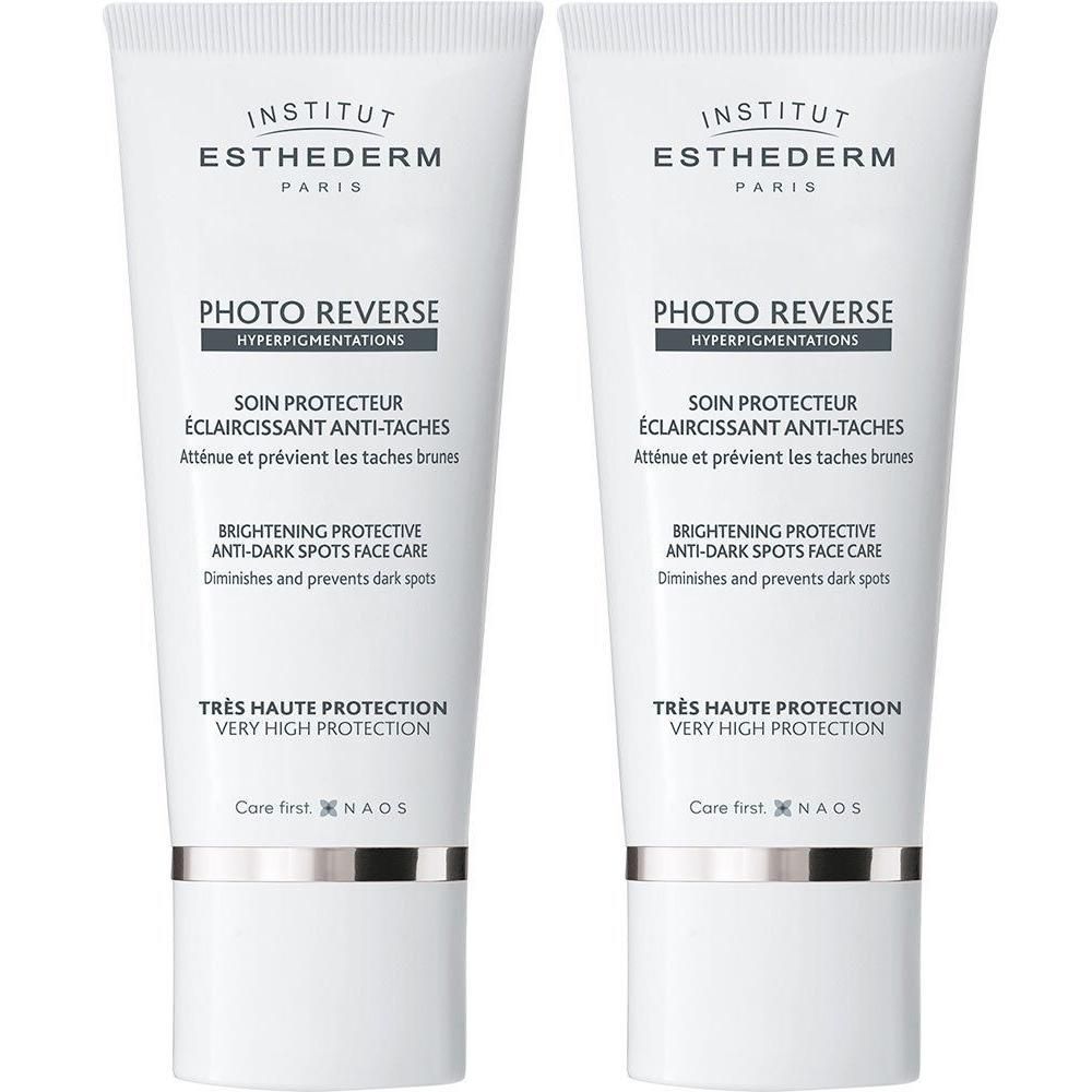 Twee tubes INSTITUT ESTHEDERM Photo Reverse. Wit, met tekst en logo. "PHOTO REVERSE" en "SOIN PROTECTEUR".