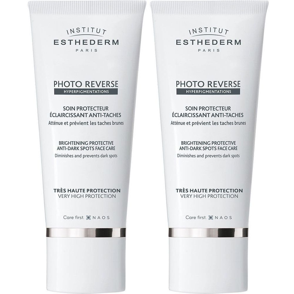 Twee tubes INSTITUT ESTHEDERM Photo Reverse. Wit, met tekst en logo. "PHOTO REVERSE" en "SOIN PROTECTEUR".