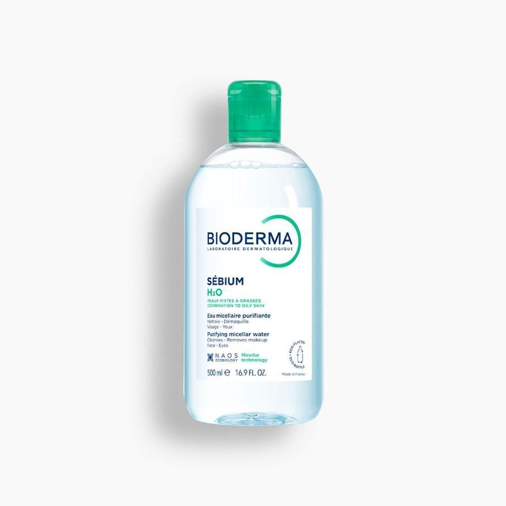 Een fles met groene dop. Opschrift: BIODERMA, Sébium H2O, Eau micellaire purifiante. 500 ml.
