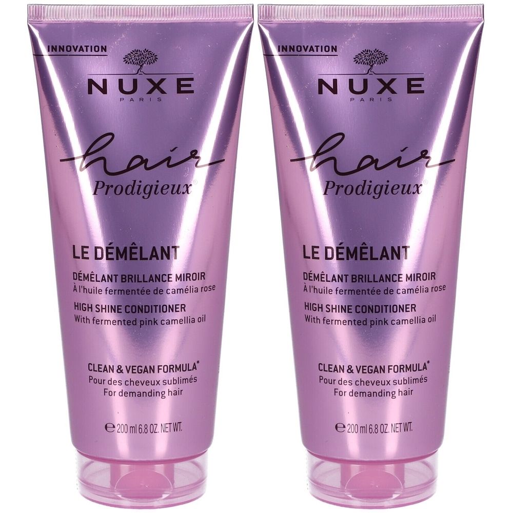 Twee tubes Nuxe Hair Prodigieux® Le Démêlant. Roze-paarse tint, tekst en productinformatie.