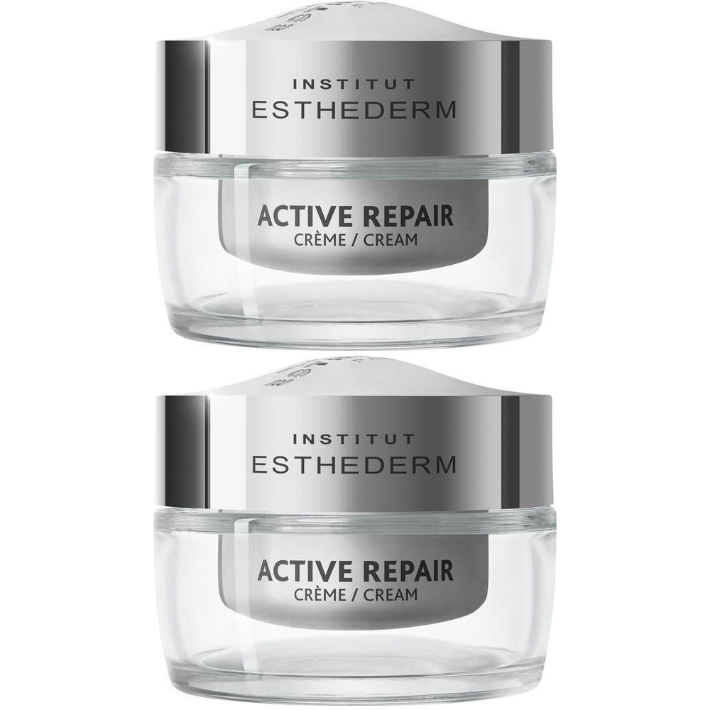 Deux pots de crème INSTITUT ESTHEDERM Active Repair. Récipients en verre avec couvercle argenté. Texte: ACTIVE REPAIR, Crème Correctrice Rides.