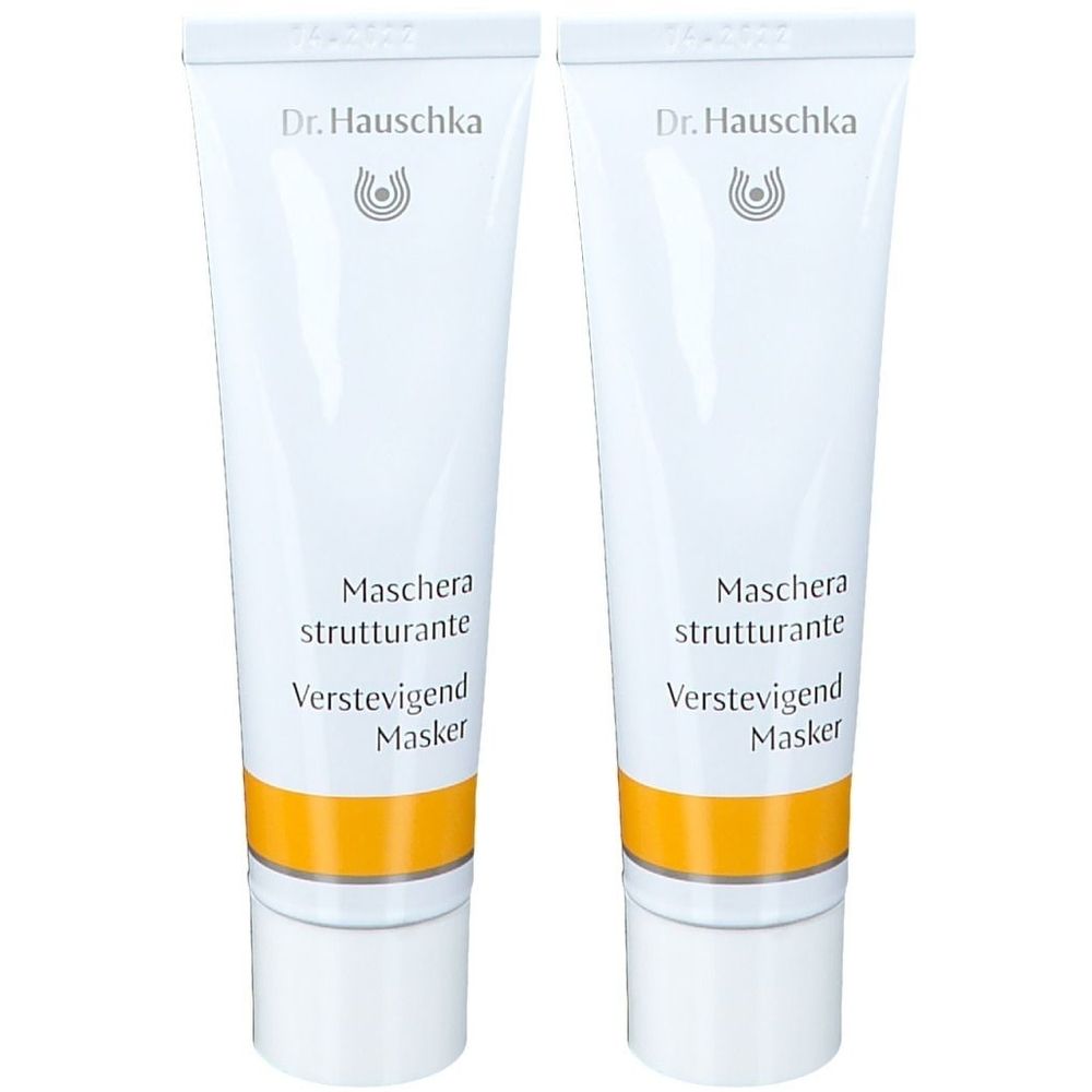 Deux tubes blancs avec une bande jaune. Inscription: Dr. Hauschka, Maschera strutturante, Verstevigend Masker.