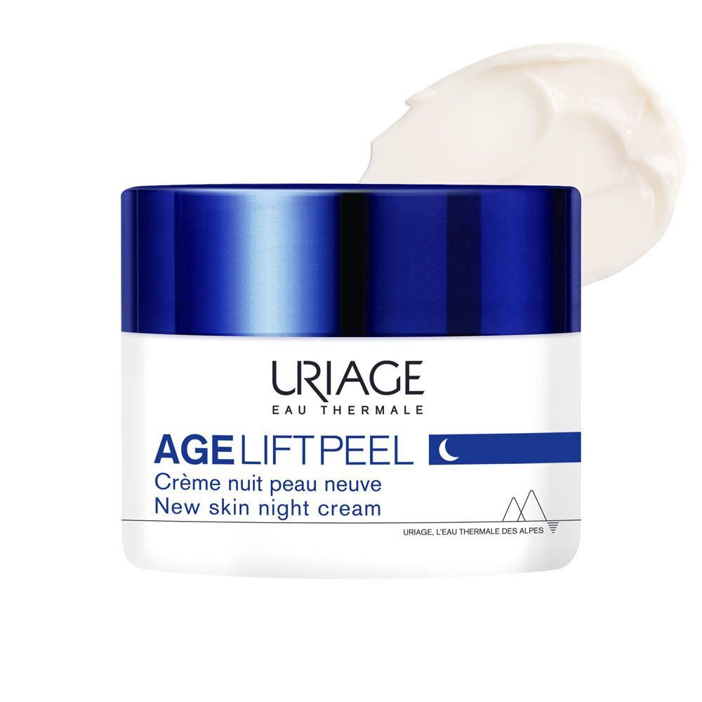 Een pot Uriage Age Lift Peel nachtcrème. Witte pot met blauwe deksel. Crème ernaast.