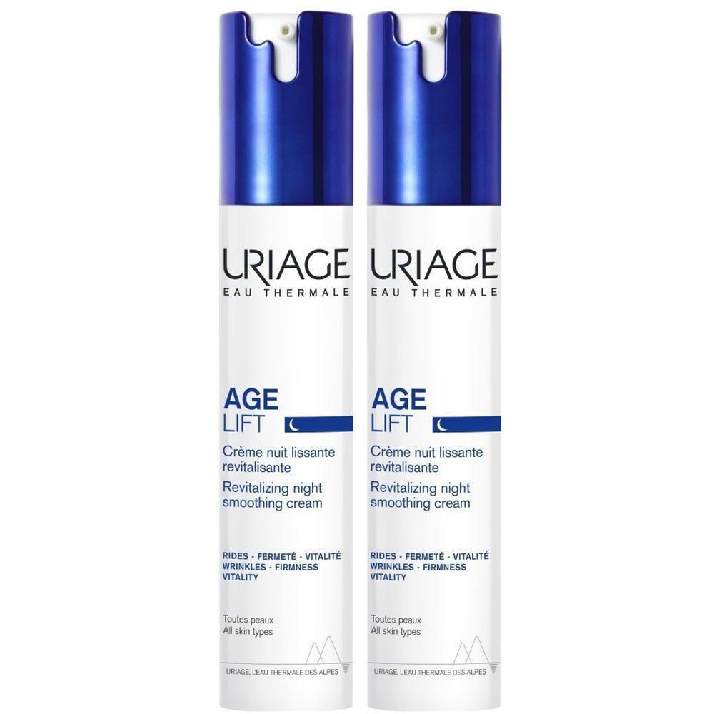 Twee flessen Uriage Age Lift nachtcrème. Witte flessen met blauwe dop. Tekst: Age Lift, Crème nuit lissante.