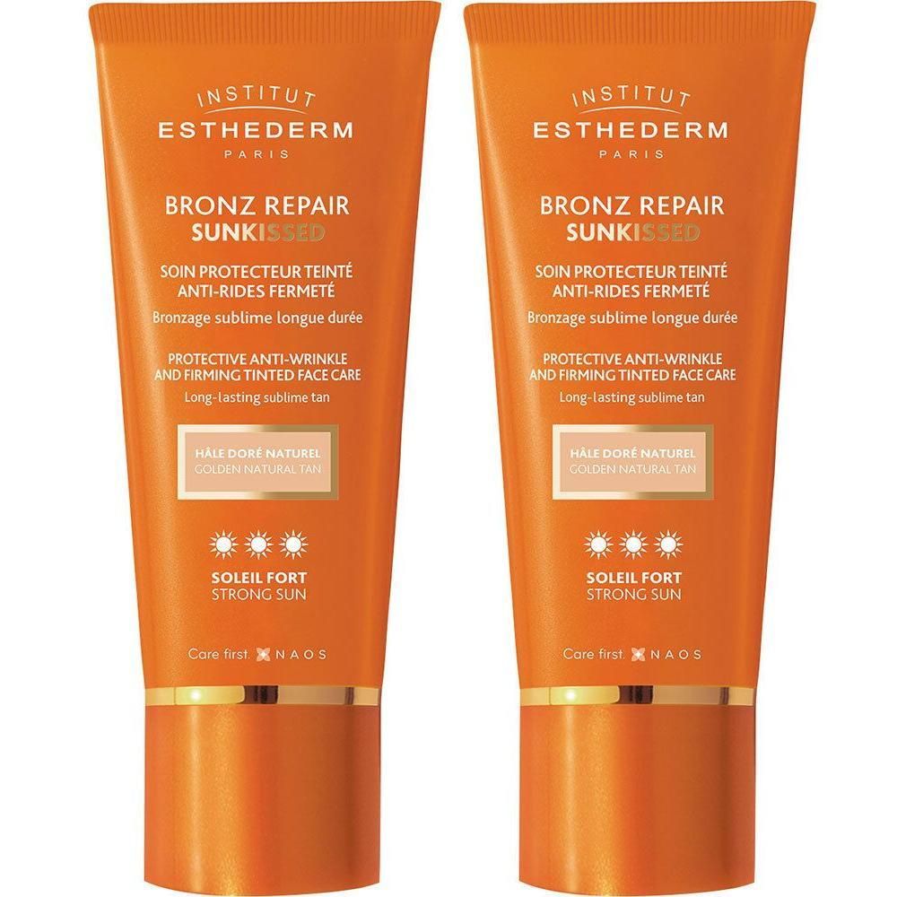 Deux tubes INSTITUT ESTHEDERM Bronz Repair Sun Kissed. Emballage orange, bouchon doré. Texte: protection solaire, anti-rides.