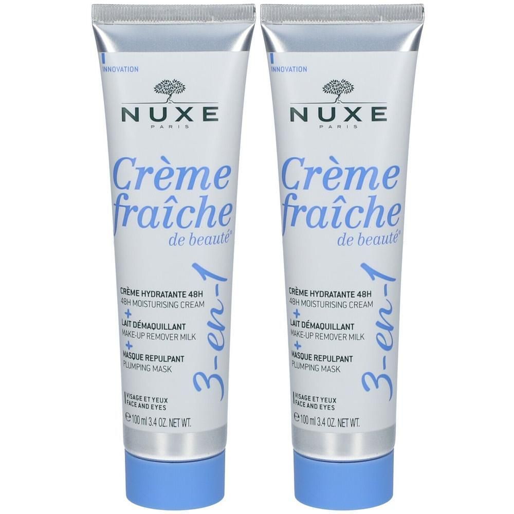 Twee tubes Nuxe Crème Fraîche de Beauté 3-en-1. Witte tubes met blauwe dop. Opschrift: Nuxe, Crème fraîche de beauté.