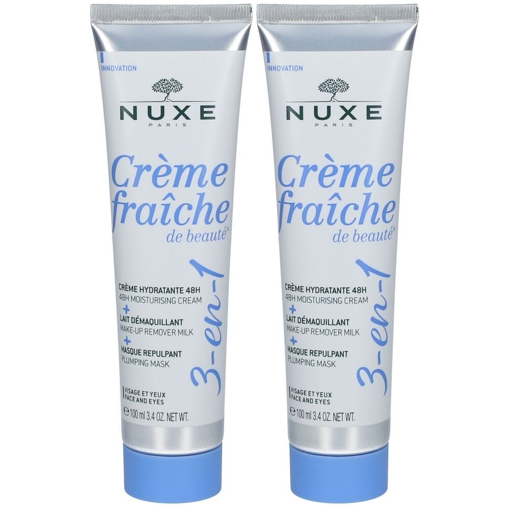 Twee tubes Nuxe Crème Fraîche de Beauté 3-en-1. Witte tubes met blauwe dop. Opschrift: Nuxe, Crème fraîche de beauté.