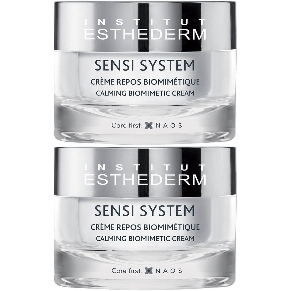 Twee potten SENSI SYSTEM crème. Opschrift: INSTITUT ESTHEDERM, CRÈME REPOS BIOMIMÉTIQUE, CALMING BIOMIMETIC CREAM.