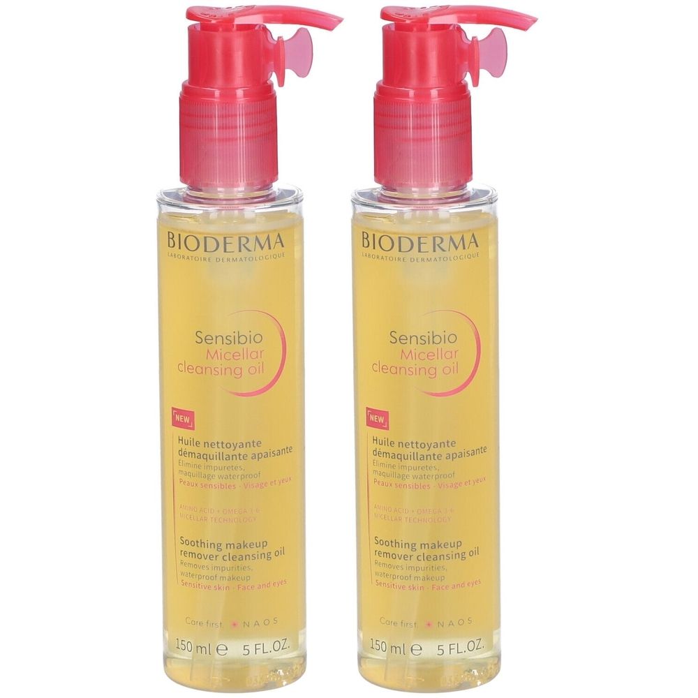 Twee flessen Bioderma Sensibio Micellar Cleansing Oil met roze pomp. Gele vloeistof, producttekst zichtbaar.