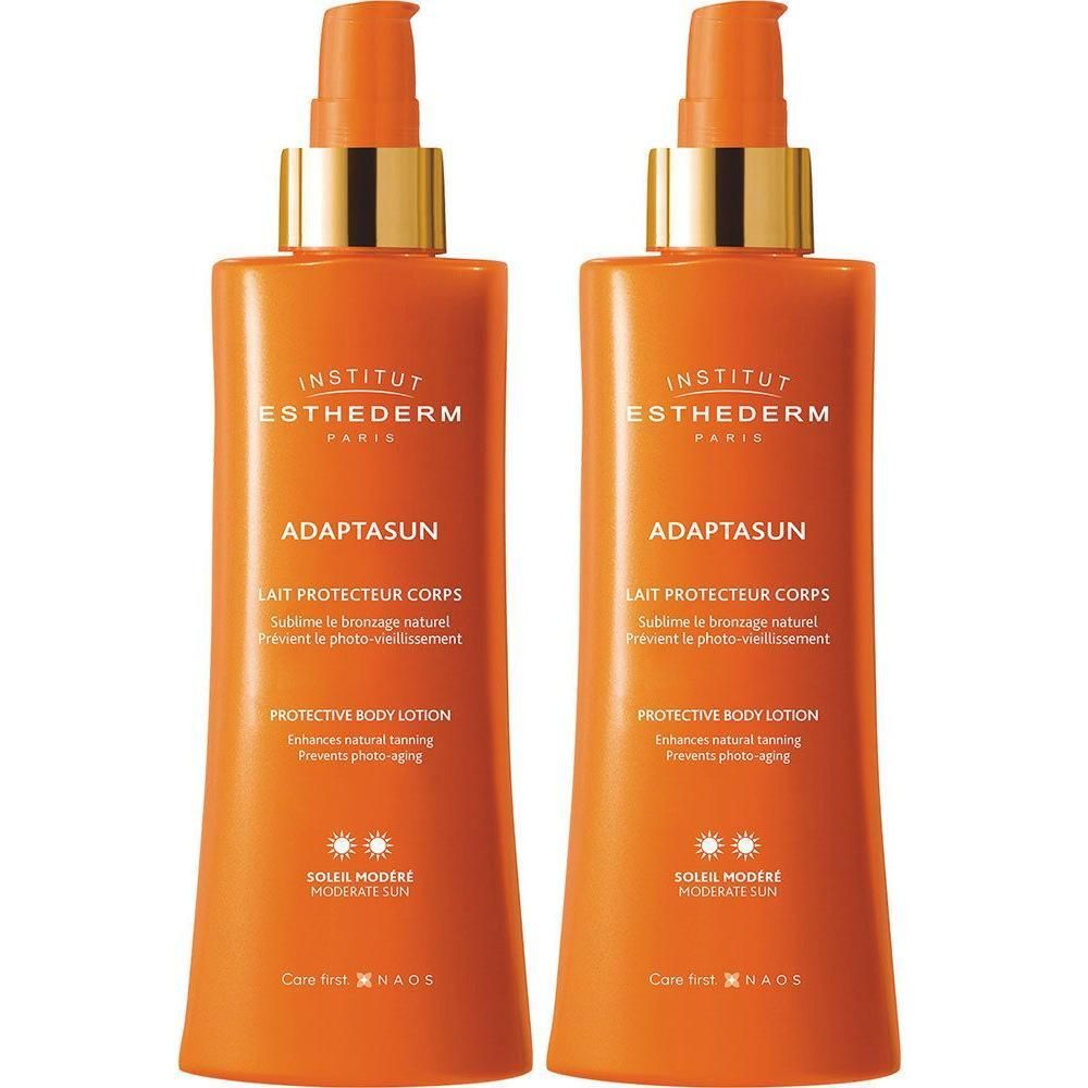 Deux flacons orange avec pompes dorées. Inscription: Adaptasun, Lait Protectteur Corps, Soleil Modéré.