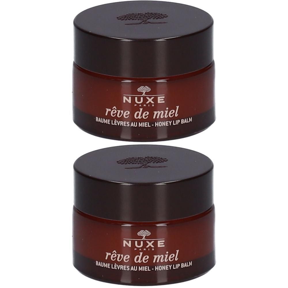 Twee potjes Nuxe Rêve de Miel lippenbalsem. Bruine deksels, transparante potjes. Opschrift: Nuxe, Rêve de Miel, Baume Lèvres au Miel.