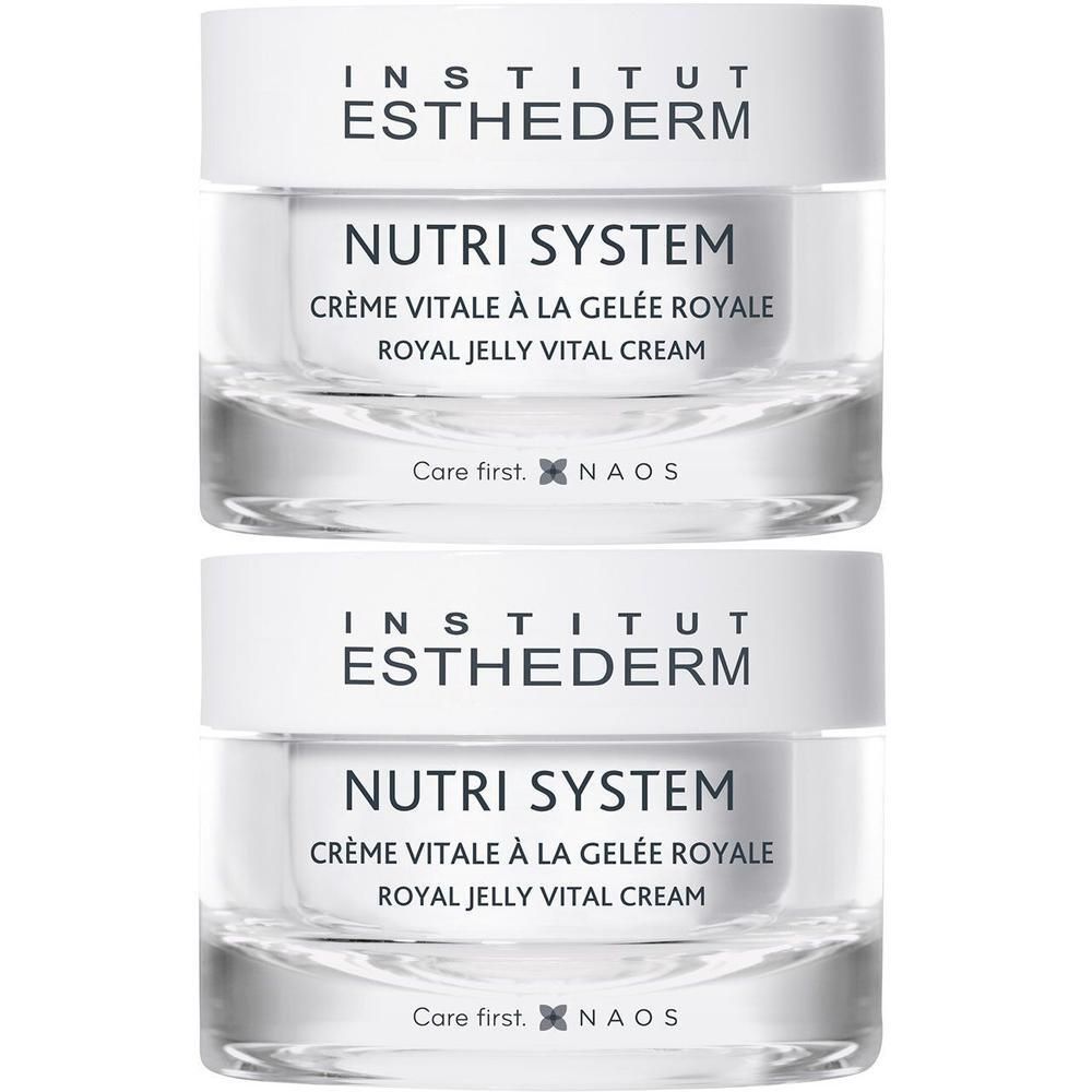 Twee potten Institut Esthederm Nutri System Crème Vitale a la Gelée Royale. Witte deksels, transparante potten, tekst.