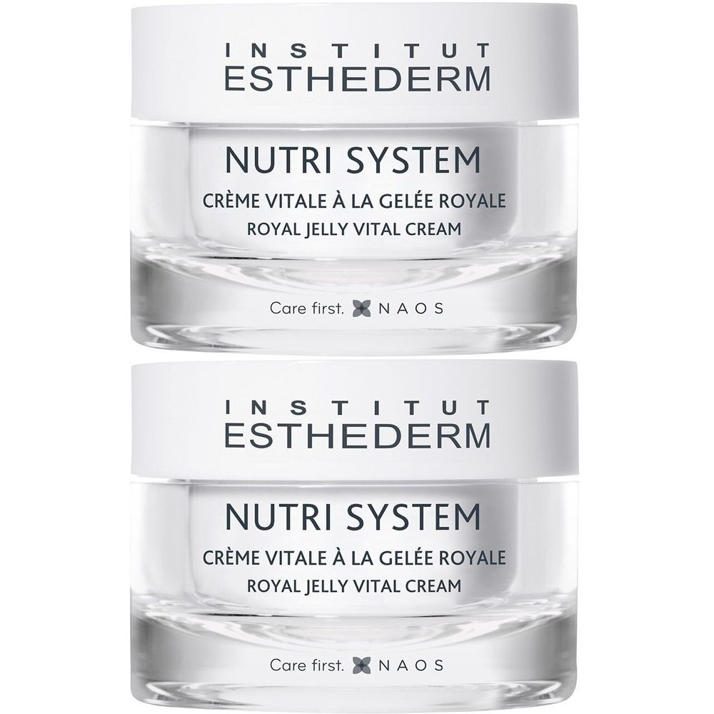 Twee potten Institut Esthederm Nutri System Crème Vitale a la Gelée Royale. Witte deksels, transparante potten, tekst.