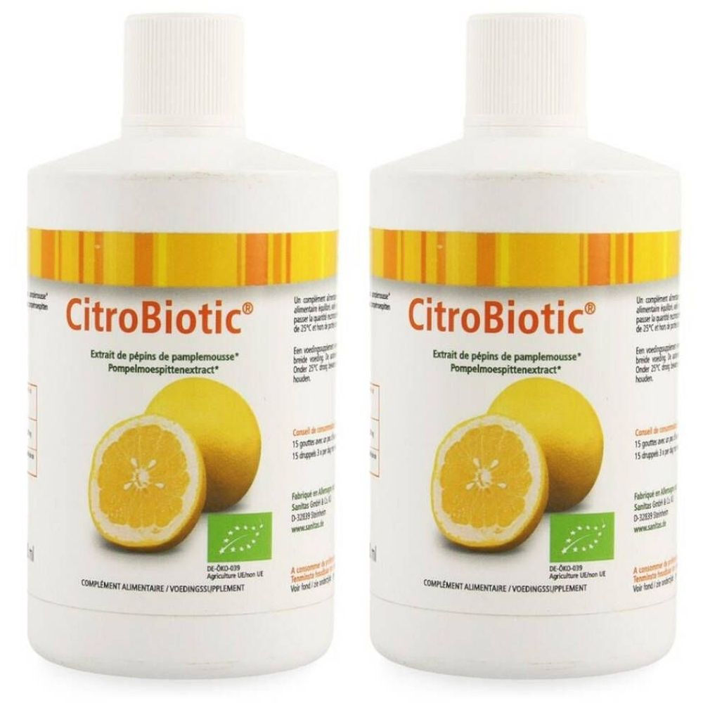Twee witte flessen met geel-oranje etiketten. Opschrift CitroBiotic, Extrait de pépins de pamplemousse. Illustratie van een grapefruit.