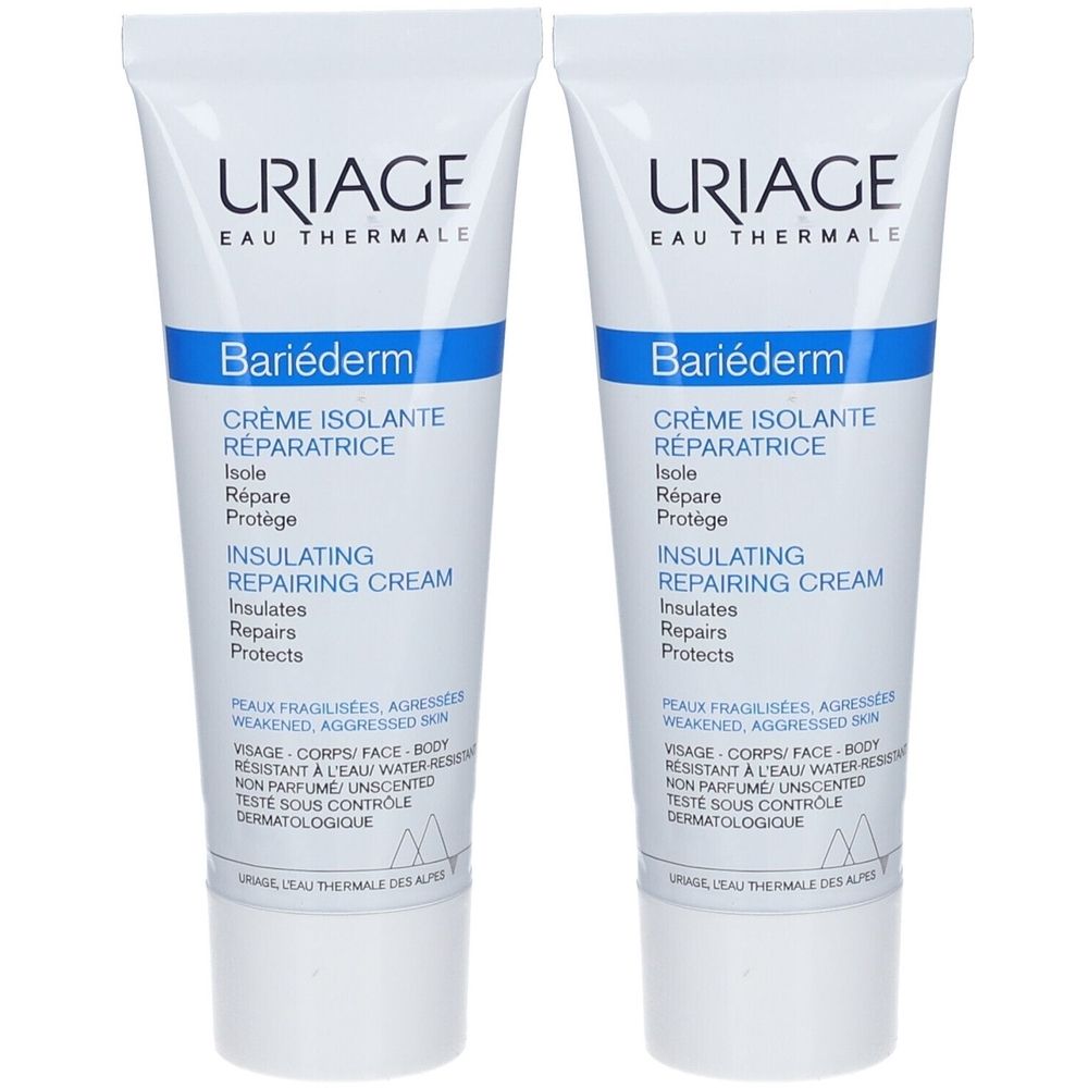 Deux tubes de crème réparatrice Uriage Bariéderm. Tubes blancs avec texte bleu. Texte: Crème Isolante Réparatrice.