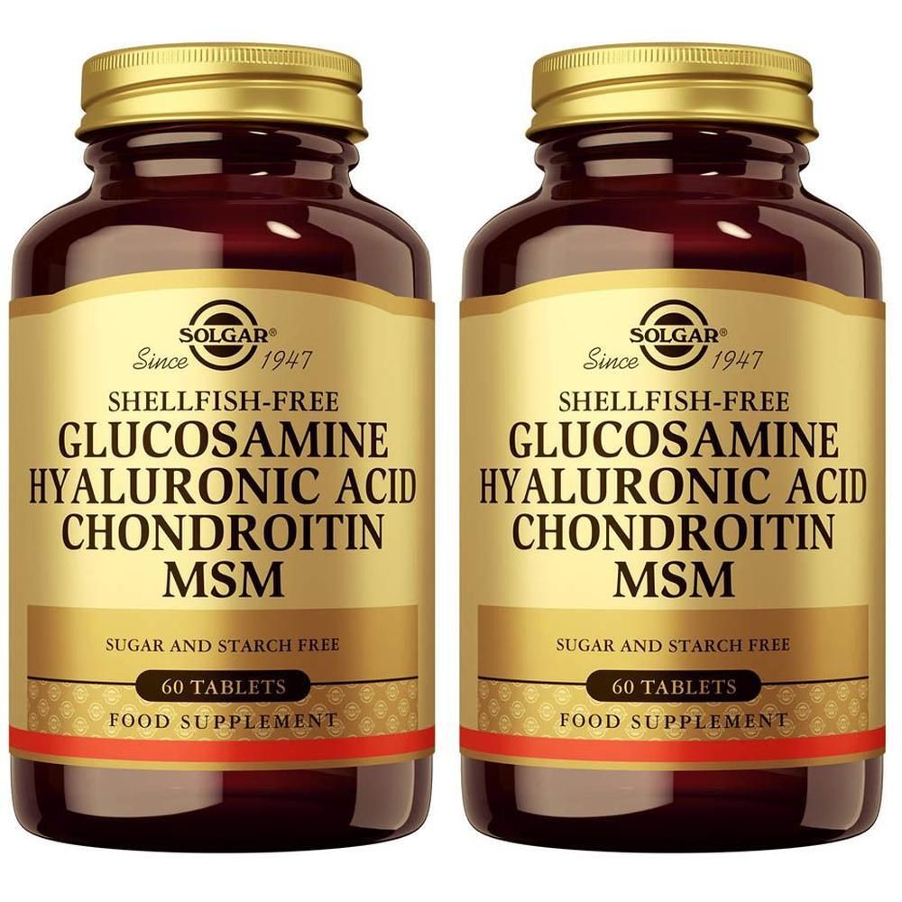 Twee bruine glazen flessen met gouden doppen, elk met 60 tabletten Solgar Glucosamine Hyaluronic Acid Chondroitin MSM.