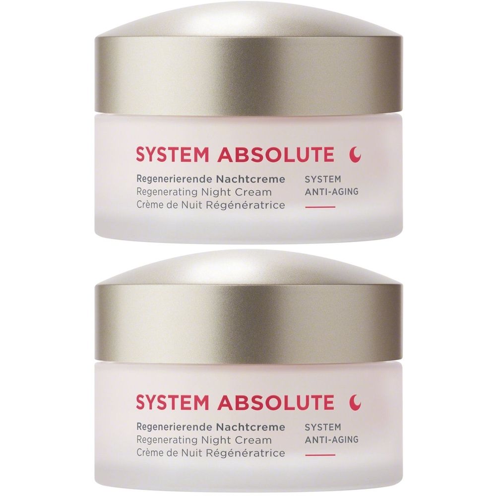 Twee crèmetiegels met deksels. Opschrift: SYSTEM ABSOLUTE Regenererende Nachtcrème. Anti-aging.