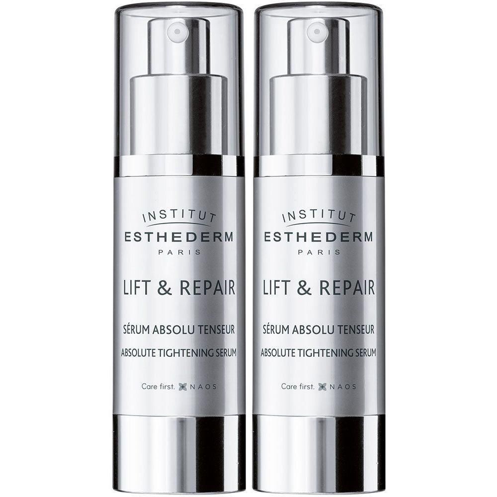 Deux flacons Institut Esthederm Lift & Repair. Flacons argentés avec pompe et texte blanc. Inscription: Lift & Repair, Sérum Absolu Tenseur.