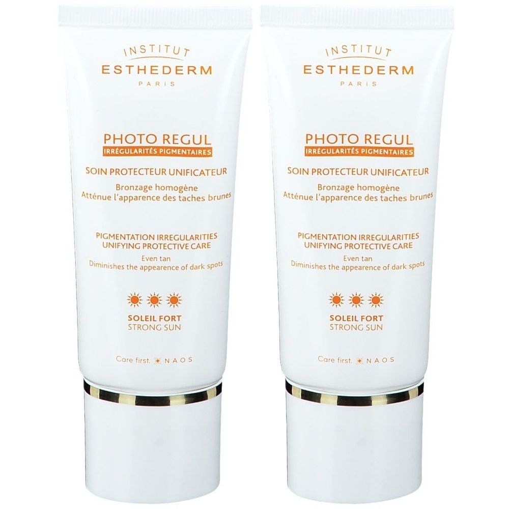 Deux tubes Institut Esthederm Photo Regul. Tubes blancs avec éléments dorés et blancs. Texte: Photo Regul, Soleil Fort, NAOS.