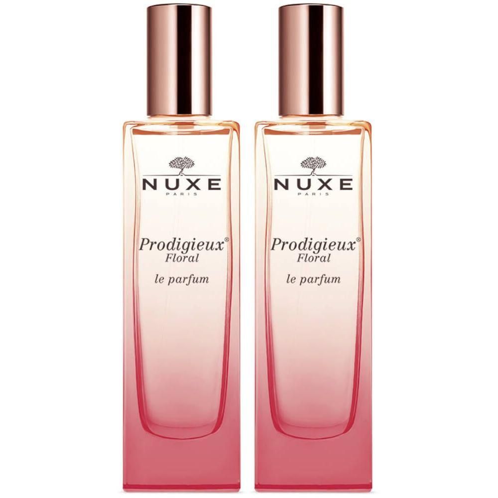Deux flacons de Nuxe Prodigieux Floral Le Parfum. Flacons rectangulaires en verre avec dégradé rose et bouchon cuivré.