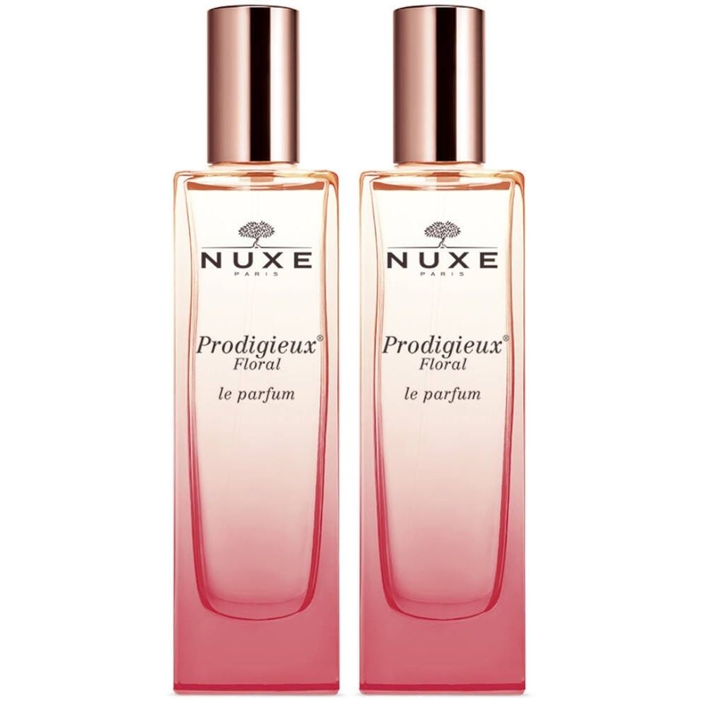 Twee flacons Nuxe Prodigieux Floral Le Parfum. Rechthoekige glazen flacons met roze kleurverloop en koperkleurige dop.