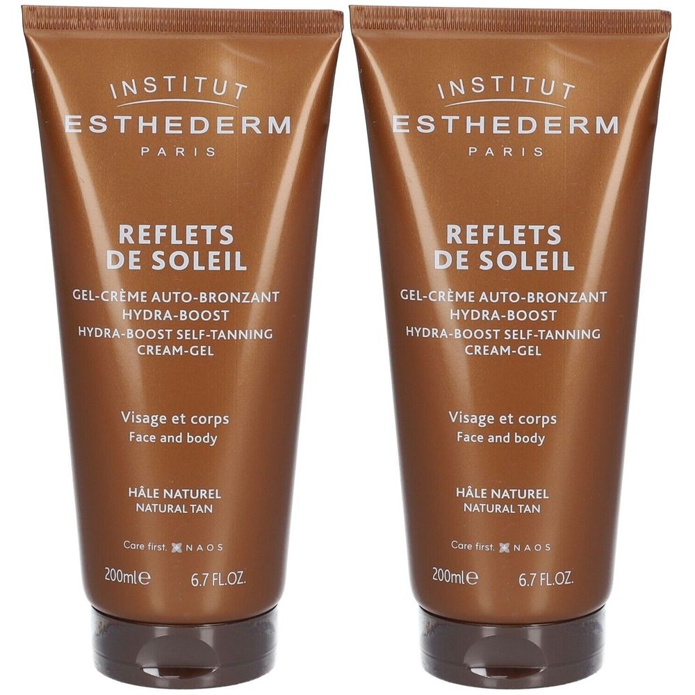 Twee tubes zelfbruiner. Bruine verpakking met witte tekst. Productnaam en details.