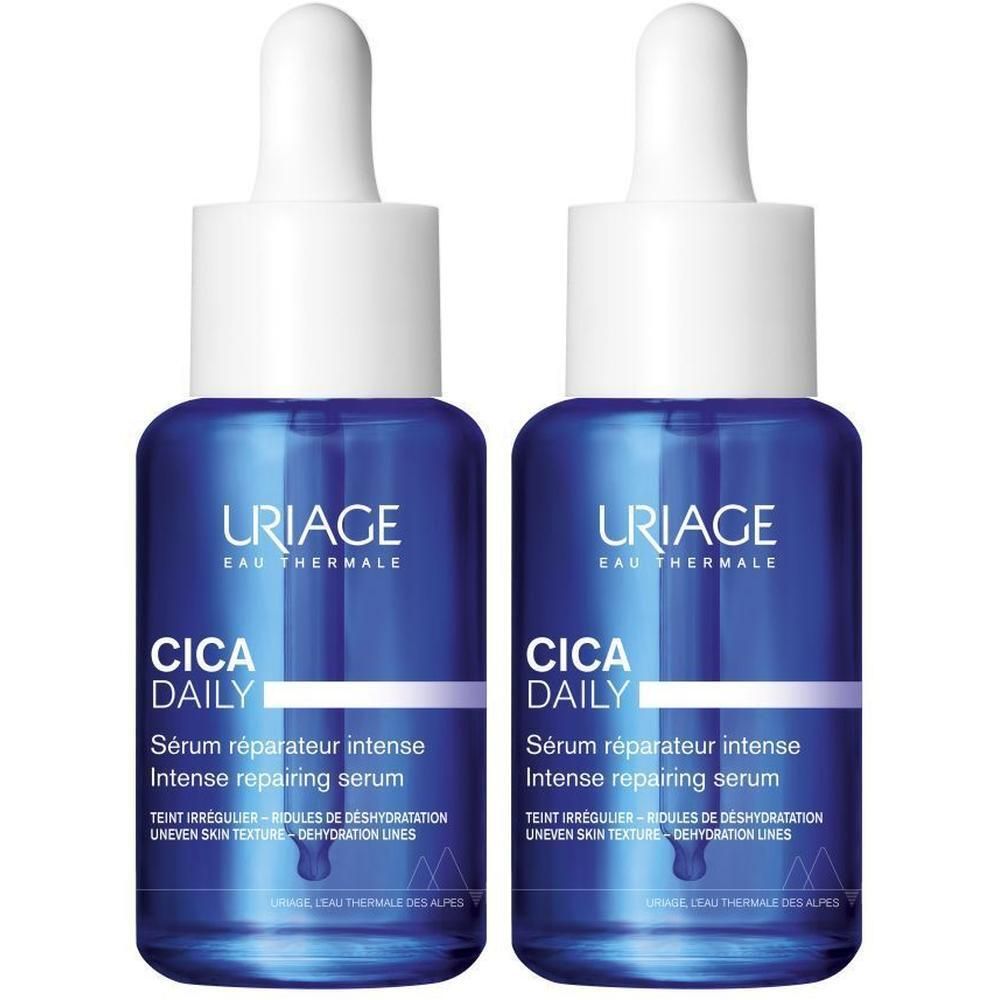 Twee blauwe flessen met witte dop. Opschrift: URIAGE, CICA DAILY, Sérum réparateur intense.