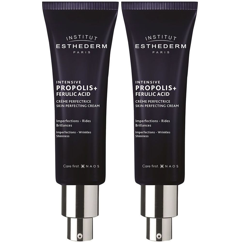 Twee crèmetubes. Donkerblauwe tubes met zilveren doppen. Tekst: INSTITUT ESTHEDERM, INTENSIVE PROPOLIS+ FERULIC ACID, Crème Perfectrice.
