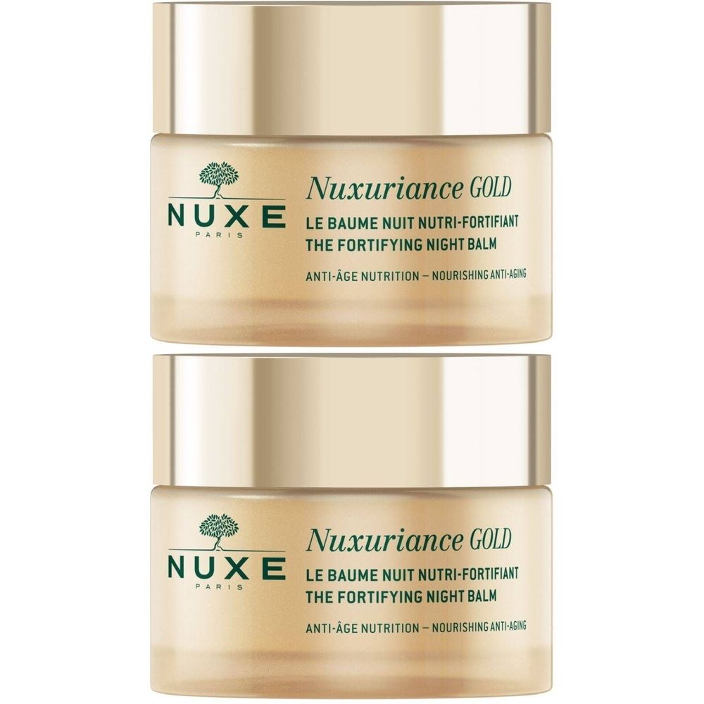 Deux pots dorés avec couvercles. Inscription: Nuxe, Nuxuriance Gold, Le Baume nuit nutri-fortifiant, The Fortifying Night Balm.