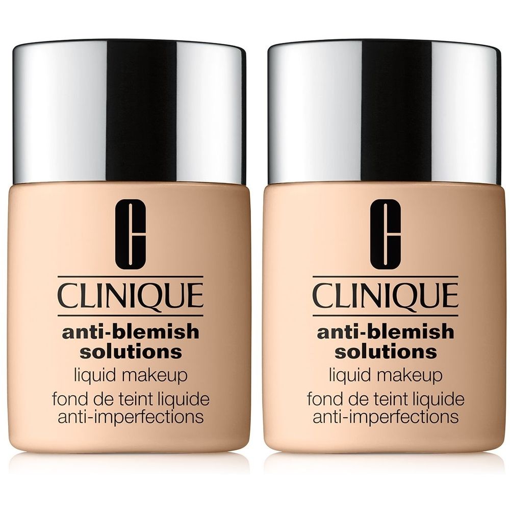 Twee flacons CLINIQUE Anti-Blemish Solutions Liquid Makeup. Beige flacons met zilveren doppen. Zwarte tekst.
