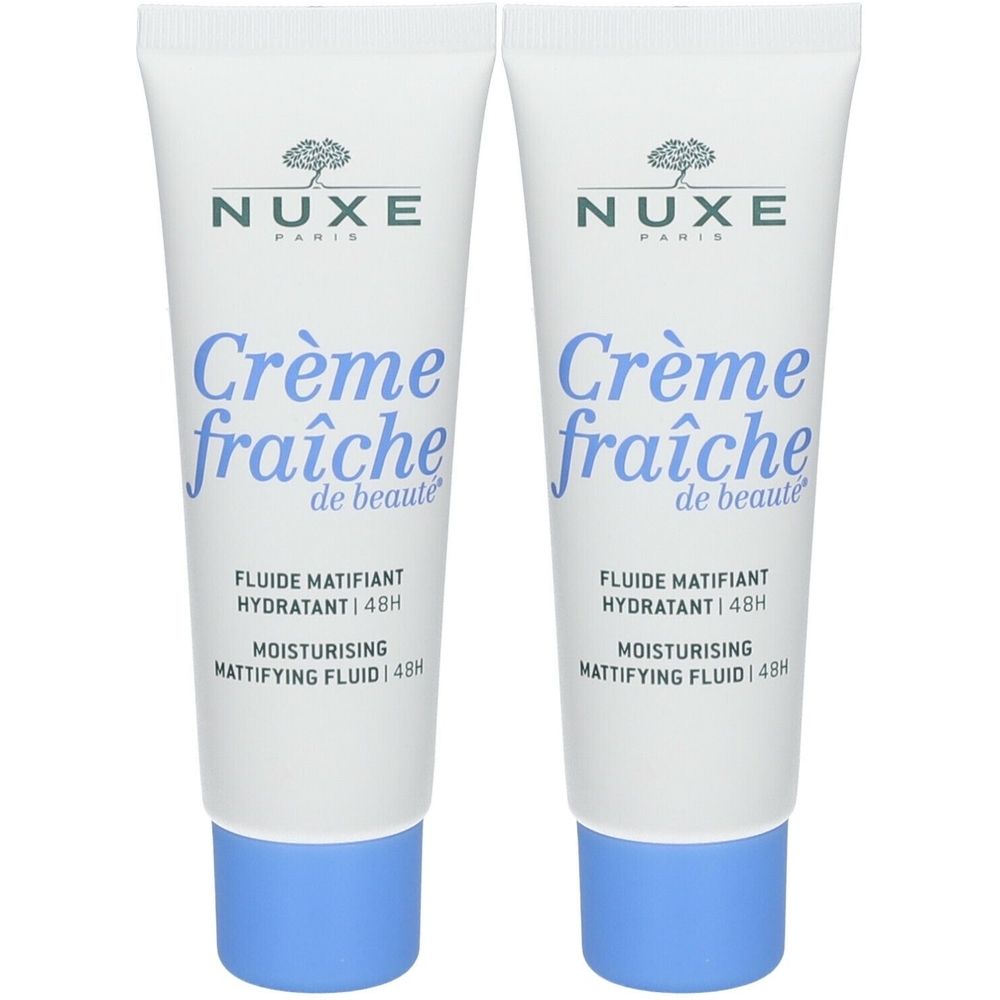 Twee tubes Nuxe Crème Fraîche de Beauté. Wit, blauwe dop, tekst zichtbaar. Productnaam en merk duidelijk zichtbaar.