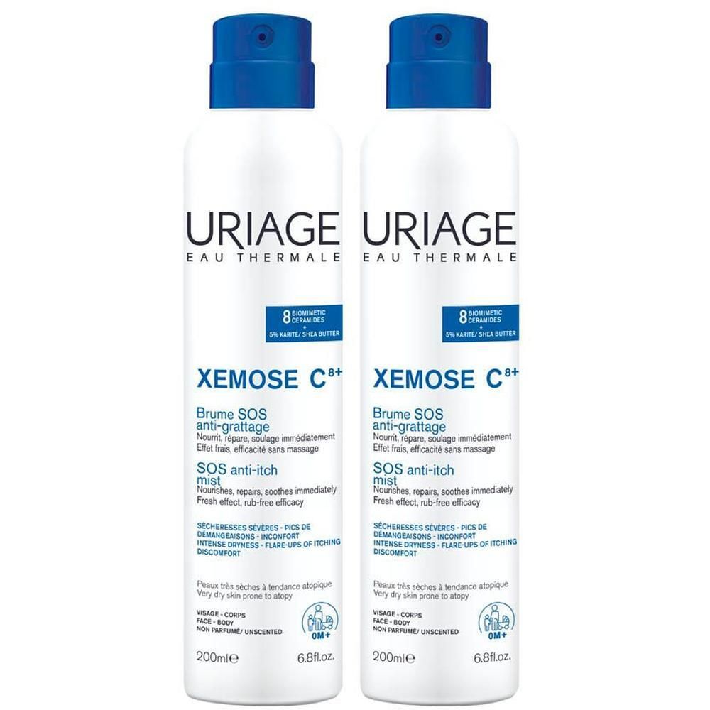 Twee witte sprays met blauwe dop. Opschrift: URIAGE, Xémose C+, SOS anti-jeuk mist.
