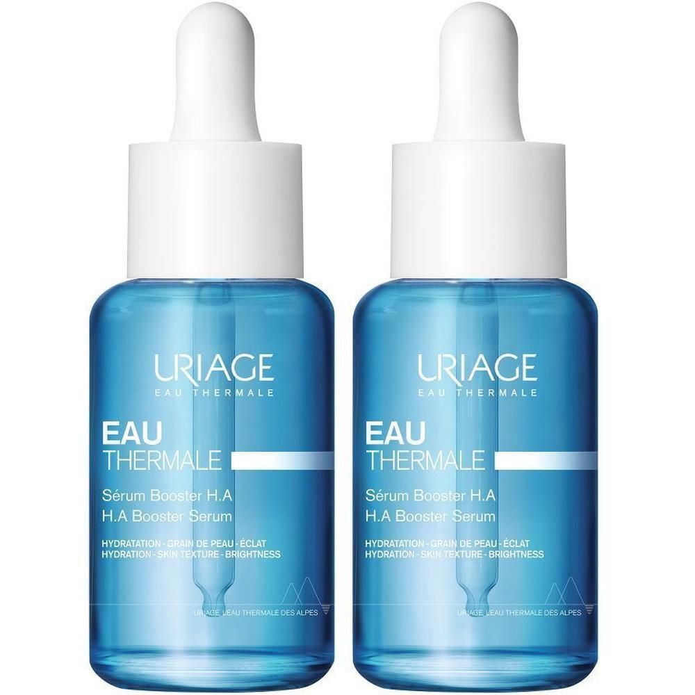 Twee Uriage Sérum Booster H.A. flacons. Blauwe glazen flacons met witte dop en pipet.