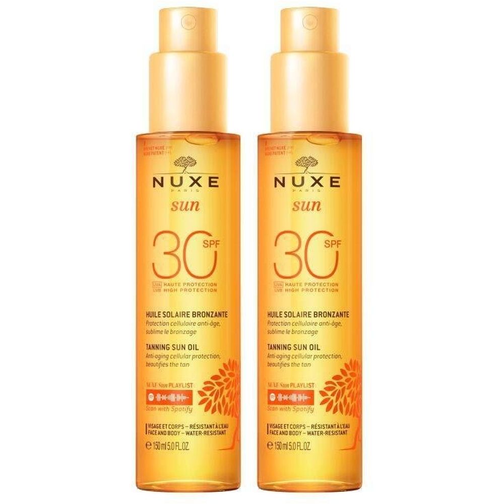 Deux flacons d'huile solaire avec vaporisateur. Inscription : Nuxe Sun, SPF 30. Texte : Huile Solaire Bronzante. 150 ml.