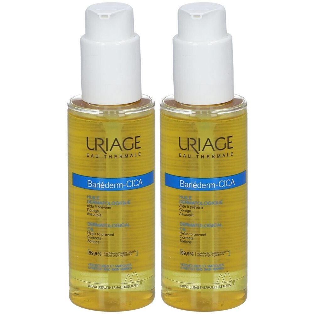 Deux flacons URIAGE Bariéderm-CICA-HUILE. Liquide jaune dans flacons transparents avec pompe blanche. Étiquettes bleues.