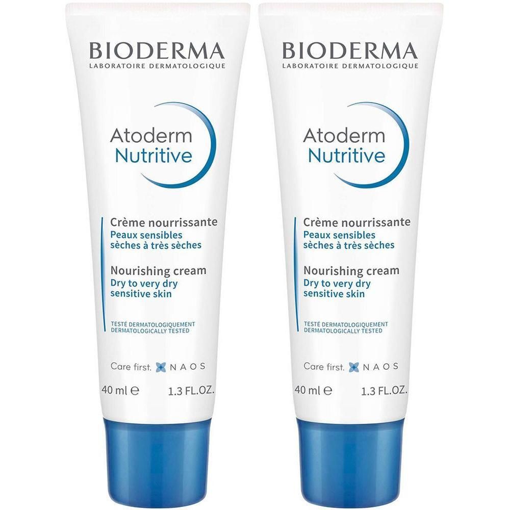 Deux tubes de BIODERMA Atoderm Nutritive. Tubes blancs avec texte et bouchon bleus. Crème nourrissante, 40 ml.