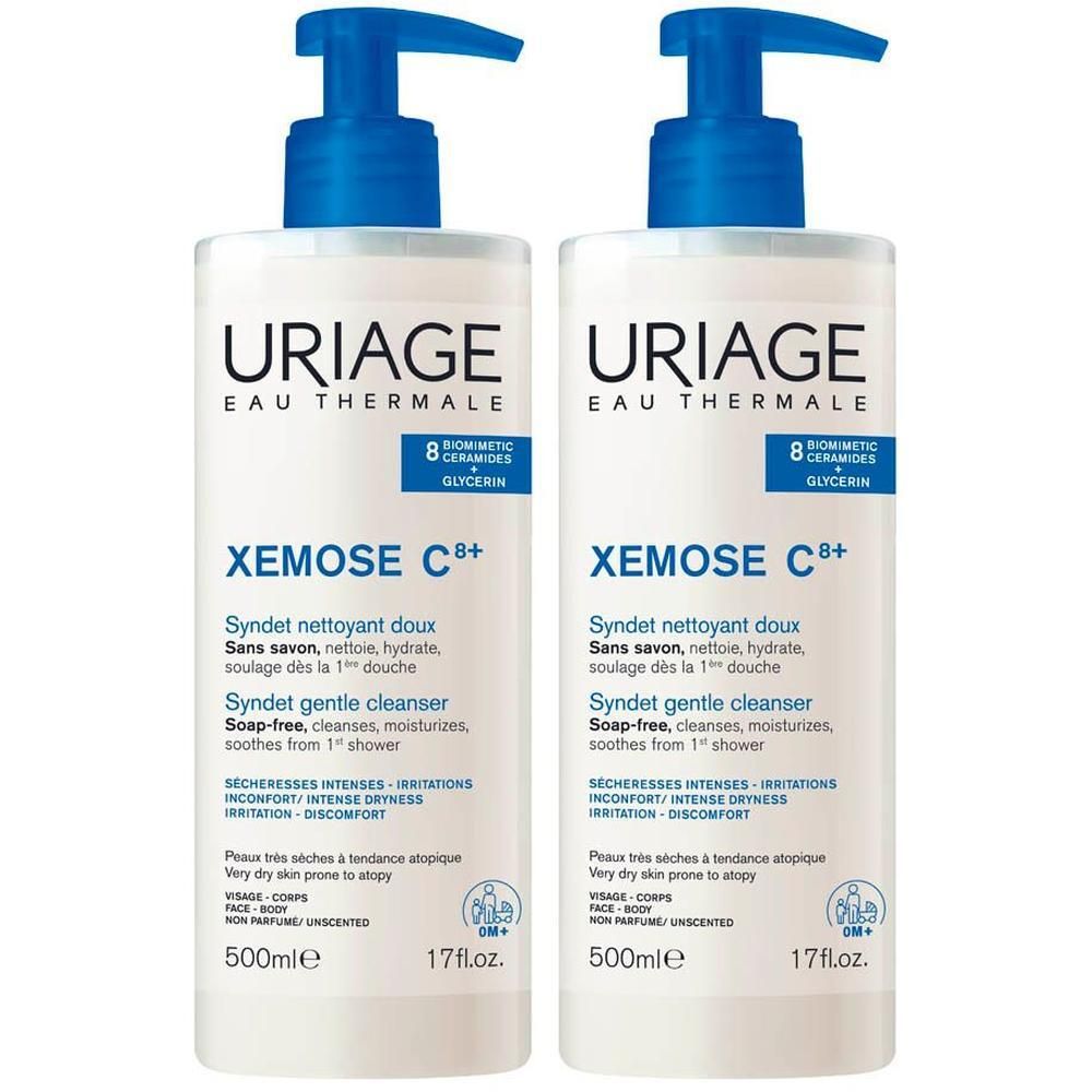 Deux flacons Uriage Xemose C+ Syndet, blancs avec pompes bleues. Texte : Uriage, Xemose C+, Syndet, 500ml, 17 fl.oz.