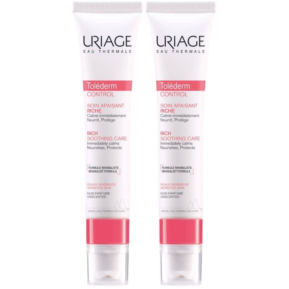 Twee tubes Uriage Toléderm CONTROL crème. Wit, met roze accenten. Opschrift: Uriage, Toléderm CONTROL.