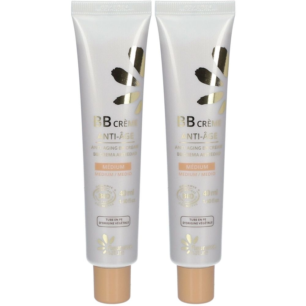 Twee tubes BB Crème Anti-Âge, tint Medium. Witte tubes met gouden accenten en productinformatie.