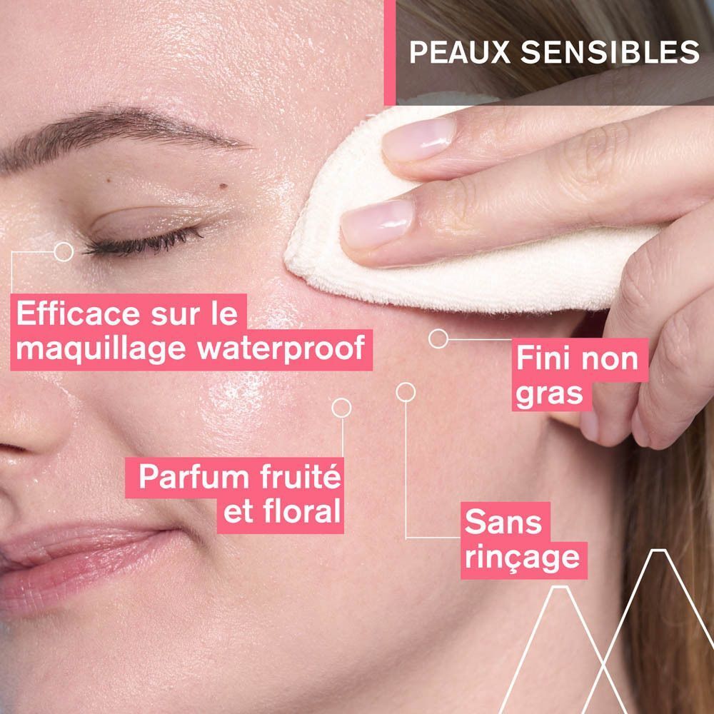 Visage d'une femme nettoyé avec un coton. Texte : Efficace sur maquillage waterproof, fini non gras, parfum fruité.