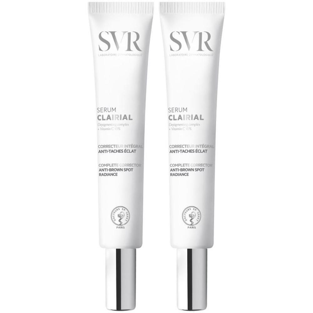 Twee tubes SVR Clairial Serum. Witte tubes met zilveren doppen. Tekst: Clairial Serum, Corrector intégral anti-taches éclat.