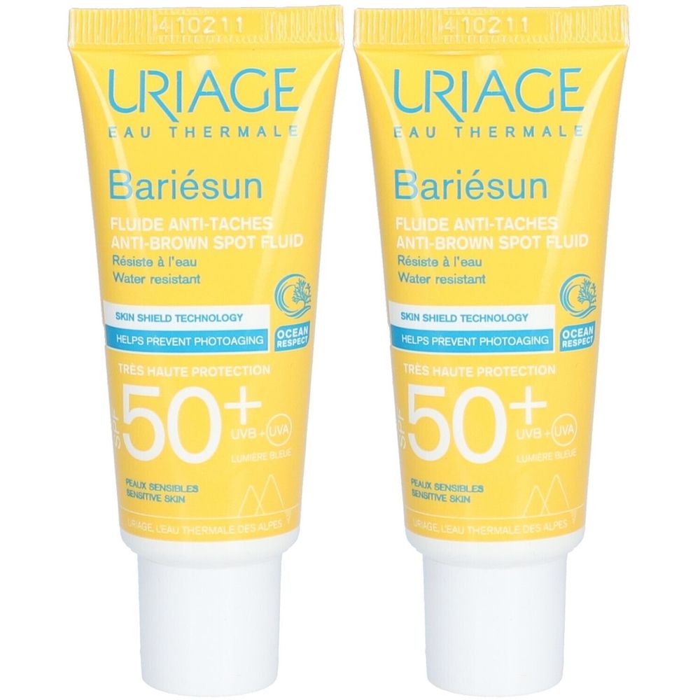Twee gele tubes Uriage Bariésun Fluide Anti-Taches SPF50+. Tekst en logo op de voorkant. Witte dop.