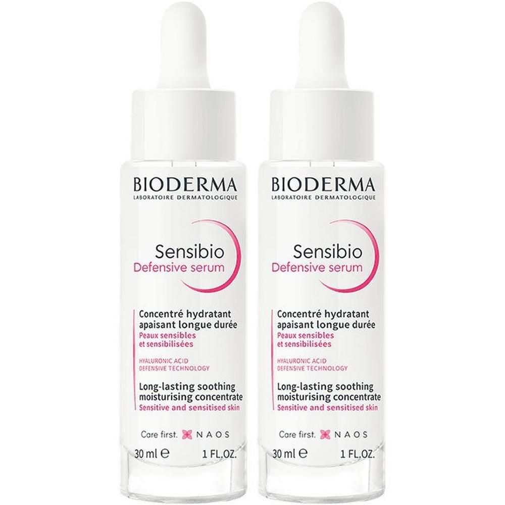 Deux flacons de sérum Bioderma Sensibio Defensive. Flacons blancs avec compte-gouttes. Nom du produit et détails imprimés.